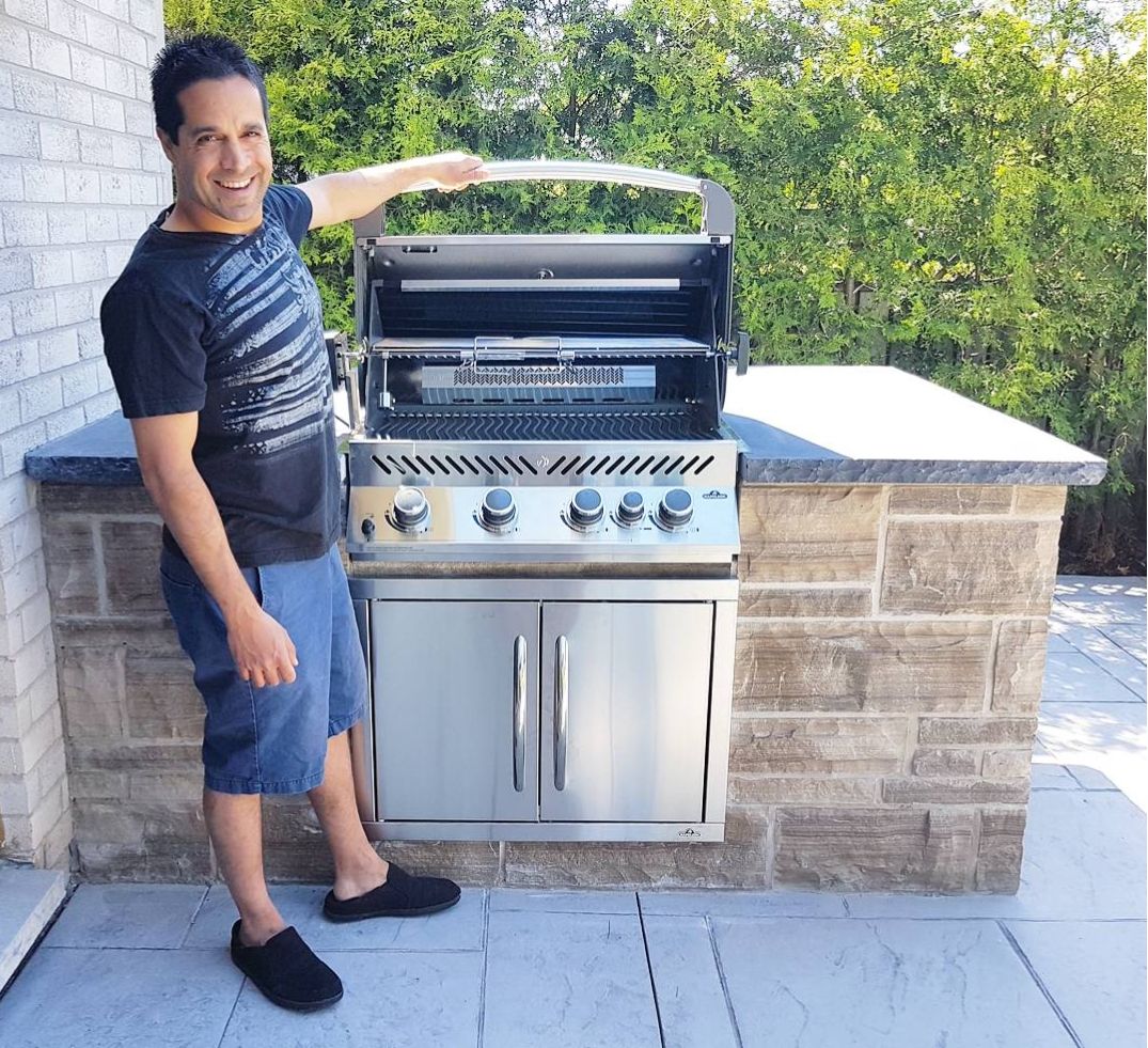 Happy Male Customer with Built-in Napoleon Prestige BIP500 RSIB by Barbecues Galore 