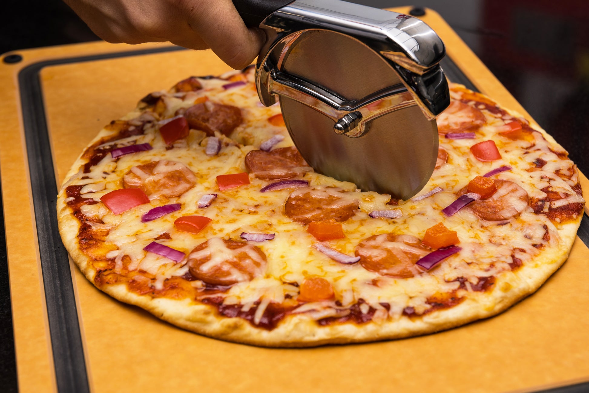 Stainless Steel Pizza Cutter on Pepperoni Pizza- 69810
