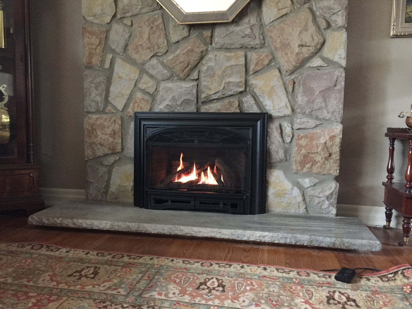 Valor Legend G3 Gas Insert Fireplace in Stone Hearth and Mantel in Calgary Home Renovation
