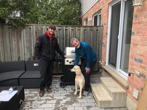 Customer and his poodle enjoying their new Broil King Monarch 340 barbecue.  Great and versatile in almost every grilling scenario.  Barbecues Galore: Burlington, Oakville, Etobicoke & Calgary